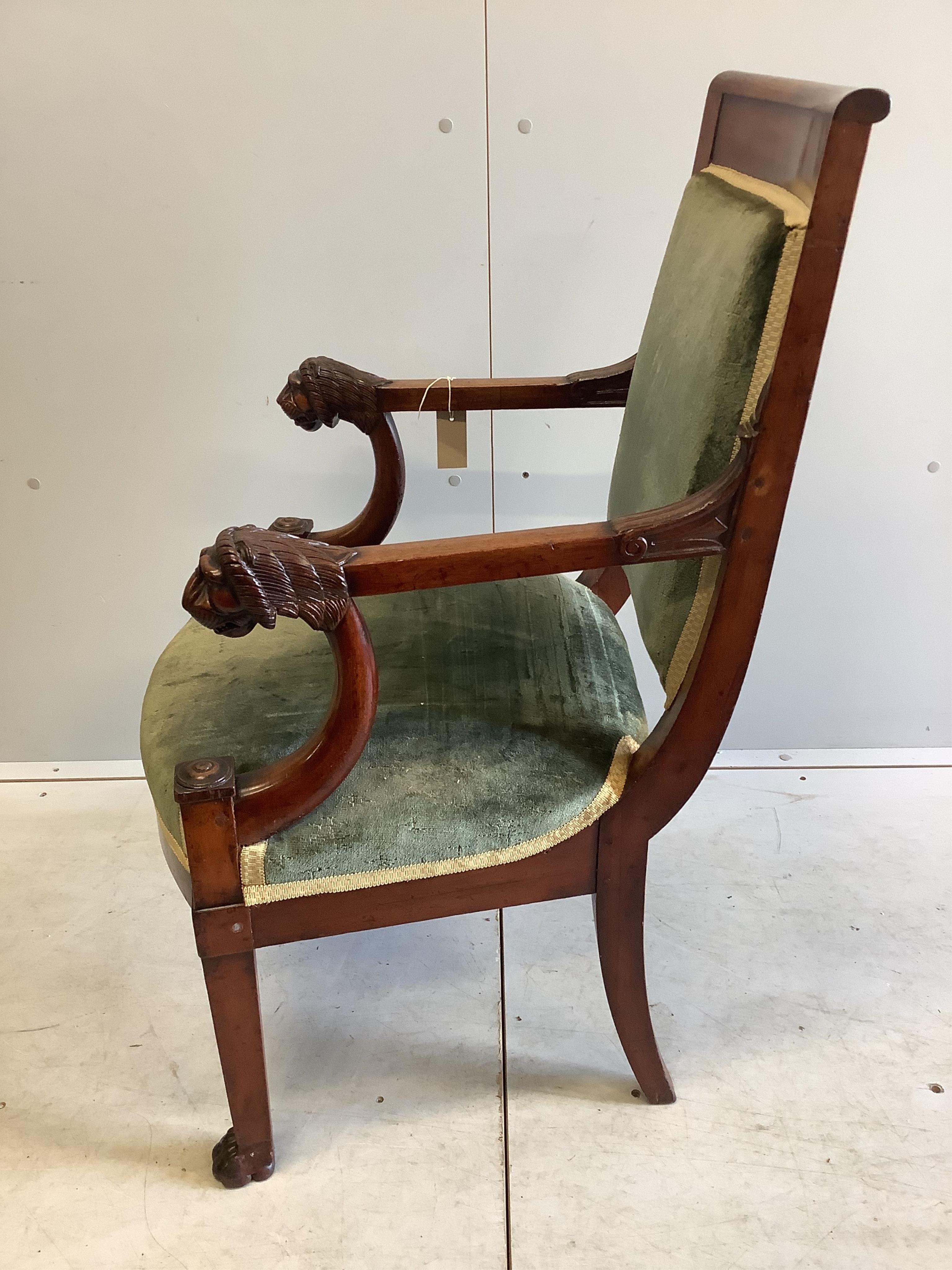 A 19th century French Empire mahogany fauteuil with carved lion's heads arms, once owned by Bernard Levin, with a letter of provenance, width 59cm, depth 49cm, height 96cm. Condition - fair